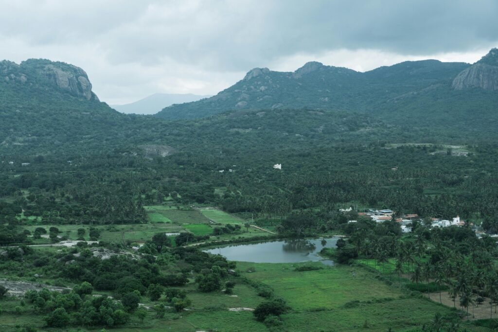 CHENNAI WEEKEND GATEWAYS A serene view of the lush green countryside and hills near Bengaluru, India.