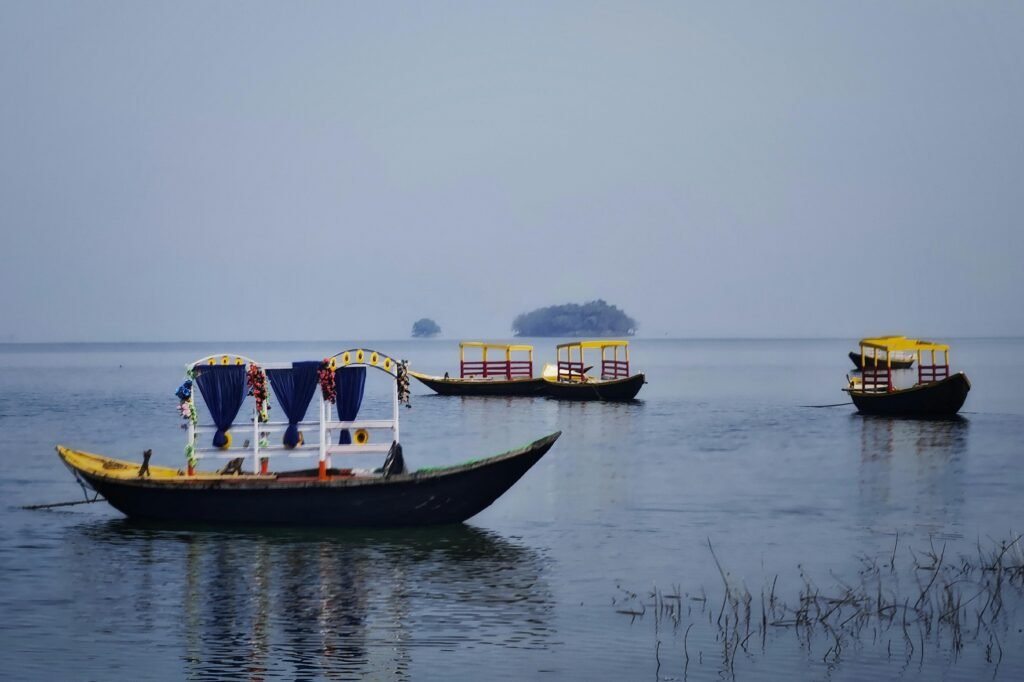 CHENNAI WEEKEND GATEWAYS Colorful boats on serene Maithon Lake, Jharkhand, ideal for travel and leisure activities.